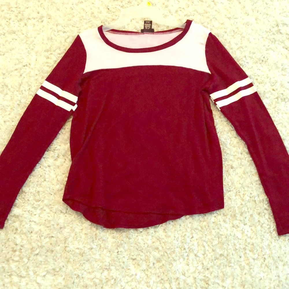 Rue 21 in a medium long sleeve shirt.